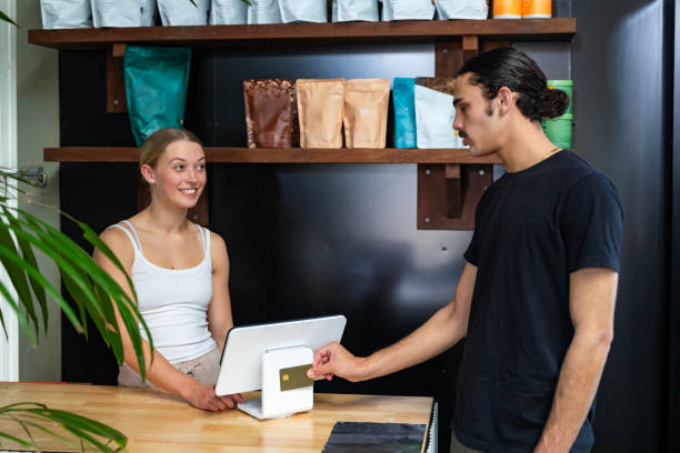 istock Paying with a credit card at a small business 2182240015
