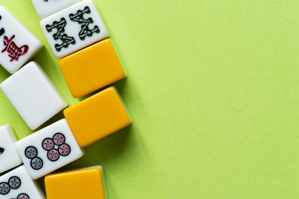 istock Mahjong tiles lined up on a green background 2182241621