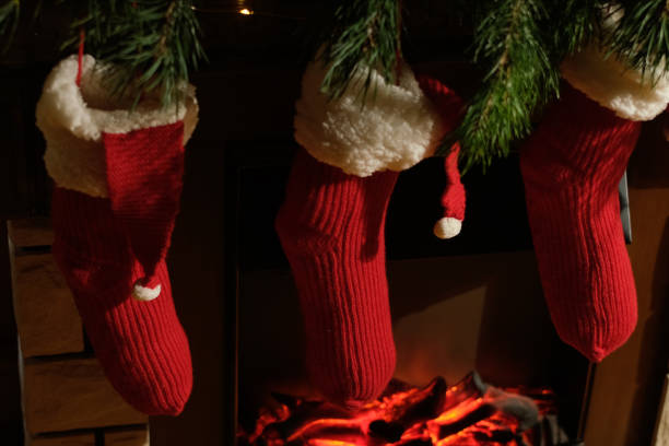 Christmas stockings hanging over fireplace.