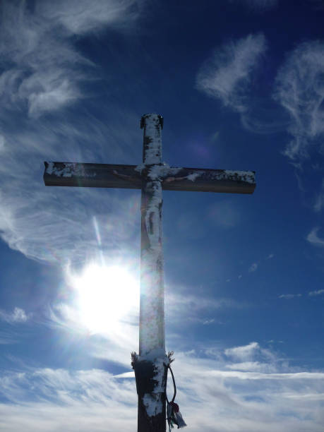 Summit cross at Brecherspitze mountain in wintertime, Bavaria, Germany