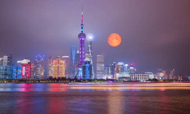 istock Shanghai Skyline with full moon at Night in China 2182243275