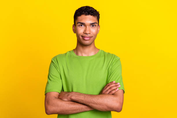 istock Photo of young handsome attractive positive guy confident folded hands professional programmer expert look you isolated on yellow color background 2182244228