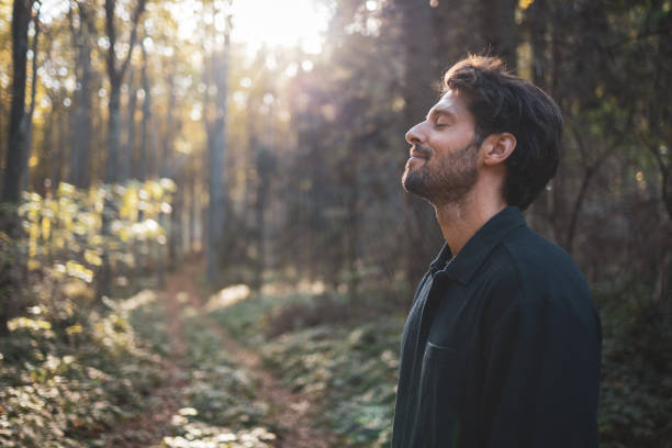 istock Man standing in the forest and enjoying 2182247211
