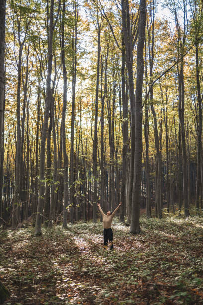 Latin woman practicing gratefulness at the woods