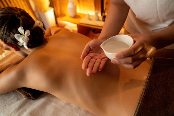 istock Masseuse prepare oil massage procedure for customer at spa. Quiescent 2182249893