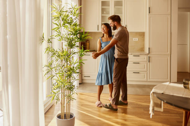 istock Carefree couple having fun while dancing at home. 2182250318