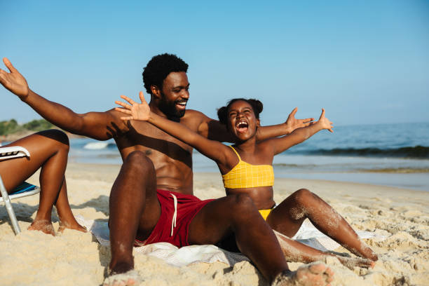 istock Joyful father and daughter enjoying a sunny beach day 2182251447