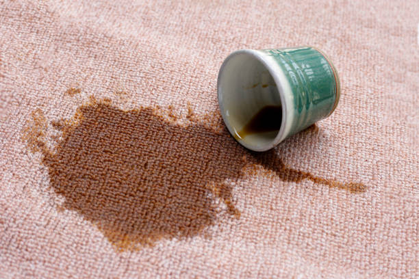 istock Coffee spilled from green cup on the carpet 2182257813