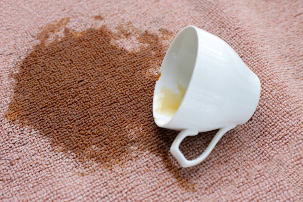 istock Coffee spilled from white cup on the carpet 2182258403