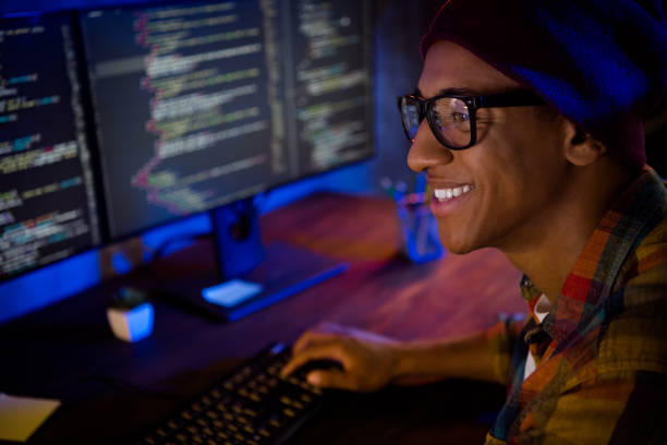 istock Profile portrait of cheerful intelligent guy operation server debugging late evening workstation indoors 2182260952