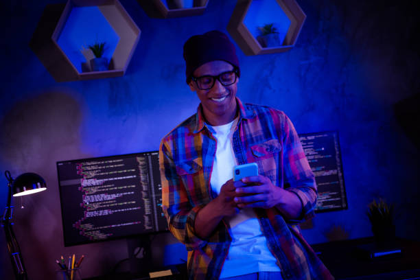 istock Photo of smart hacker guy hold use telephone server security operating evening workstation room indoors 2182260958