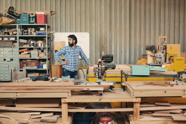 istock Mature carpenter behind his workbench in a factory 2182261532