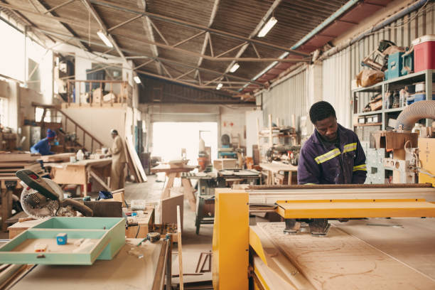 Wide angle of a carpentry workshop with workers in the background