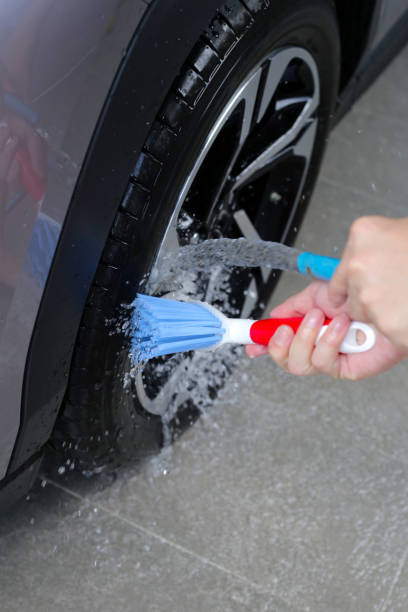 istock Washing car, cleaning tires and wheels 2182262721