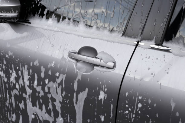 istock Car with white soap foam, Hand washing car 2182264423