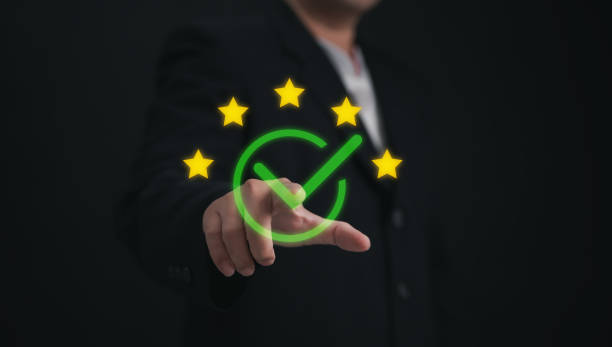 istock Concept of guarantee standards iso certification and standardization service quality and assurance : Businessman Is using finger touching for certify with five star after he has verified it. 2182269025