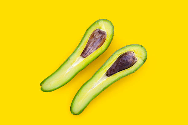 Avocado fruit isolated on white background with textures and Peanuts inside and browm seeds sport health