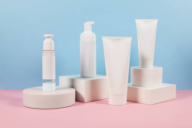 istock White plastic tubes without label displayed on podium. Scene for advertising cosmetics base 2182289688