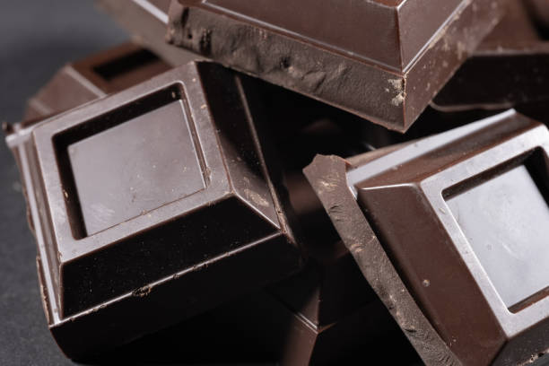 istock broken chocolate bar chips, parts or pieces pile 2182290703