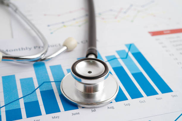 istock Stethoscope on chart or graph paper, Financial, account, statistics and business data medical health. 2182293280