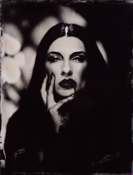 istock Female vampire stands in front of gothic window (2 of 4). atmospheric 19th century process called wetplate collodion 2182297038