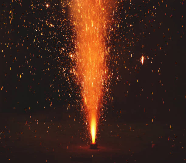 Party is over. Textured abstract backgrounds. Golden background with lit sparkler.
