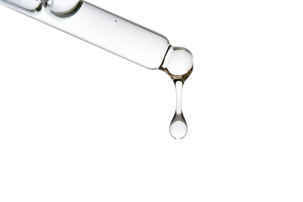 istock Dropper pipette with delicious serum with bubbles close-up. 2182297354