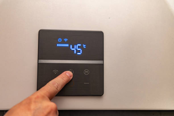 istock Saving electricity, setting the temperature in the water heater 2182298426