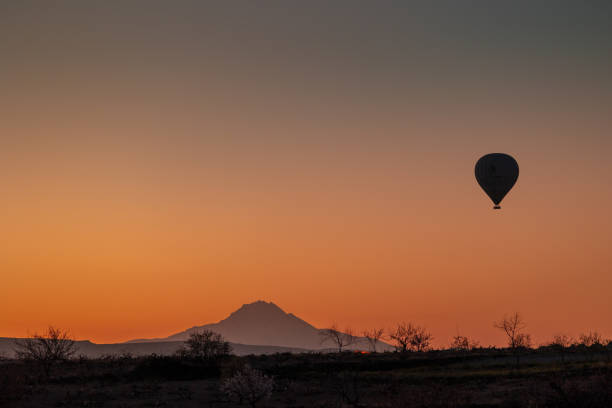 istock Balloons fly over Cappadocia at dusk 2182301704