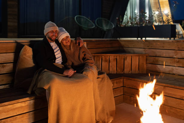 istock Couple having romantic evening in front of a firepit 2182303894