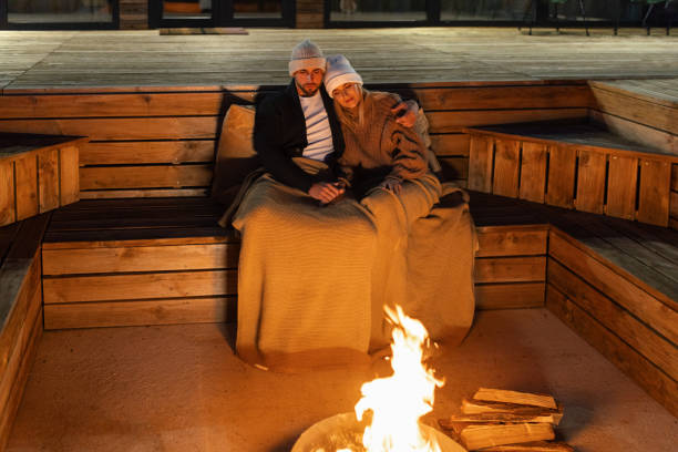 istock Couple having romantic evening in front of a firepit 2182303896