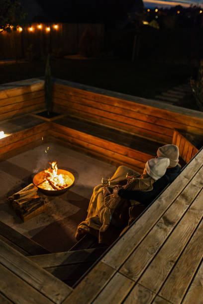 istock Couple having romantic evening in front of a firepit 2182303930