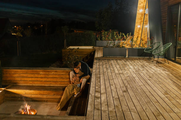 istock Couple having romantic evening in front of a firepit 2182304009