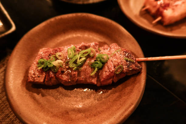 istock Japanese beef skewer with spring onion as toppings on a dish 2182306241