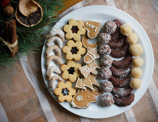 istock Gingerbread, Linzer cookies and other types of Christmas sweets on a white plate 2182306830