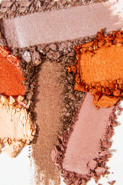 istock Composition of eyeshadow smears on a light white background. Cosmetic texture, vibrant and layered. 2182306949