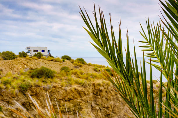 istock Camper on cliff, coast in Spain 2182312560