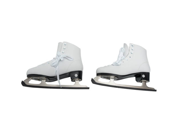 Winter skate sport people concept. Crazy girl with ice skates. Young woman has white outfit and long beutiful hair.