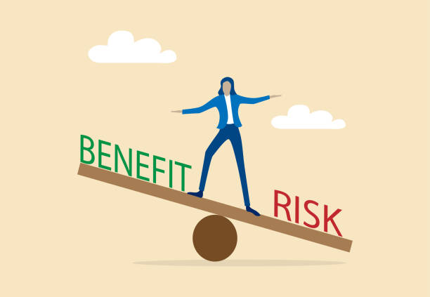 istock Businesswoman balancing between Risk and benefit.Business concept 2182316358
