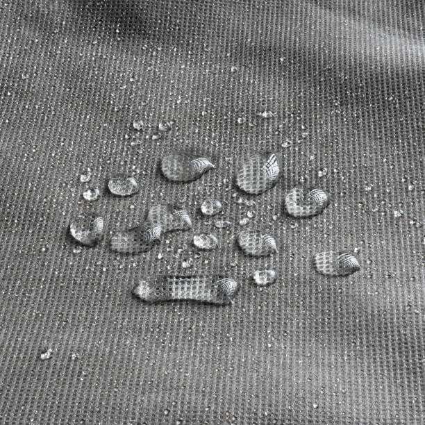 istock Waterproof fabric with water droplets. A non-absorbent material that repels water. 2182318230