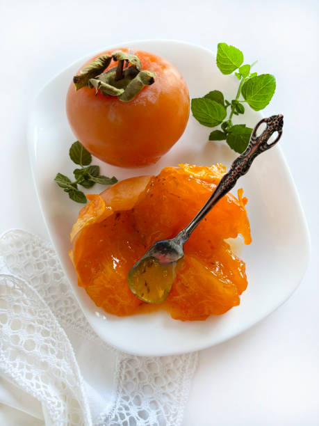 istock Ripe fresh persimmon fruits. 2182319551
