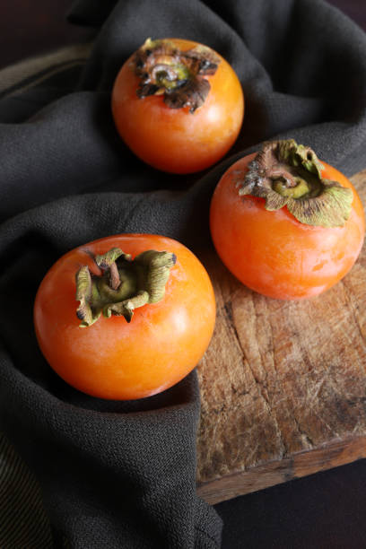 istock Fresh ripe persimmon fruits. 2182319674