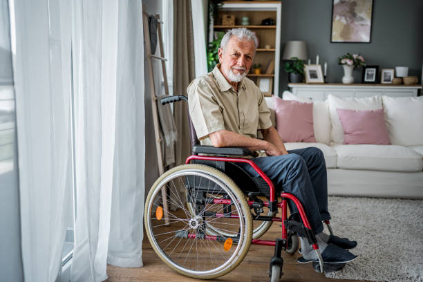 istock Senior man in a wheelchair at his home 2182322708