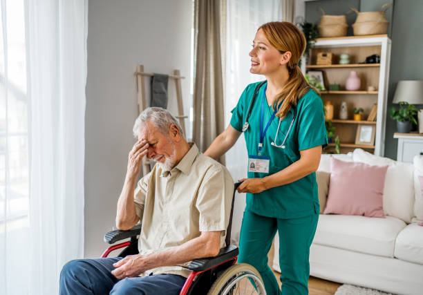istock Senior man with home caregiver 2182322814