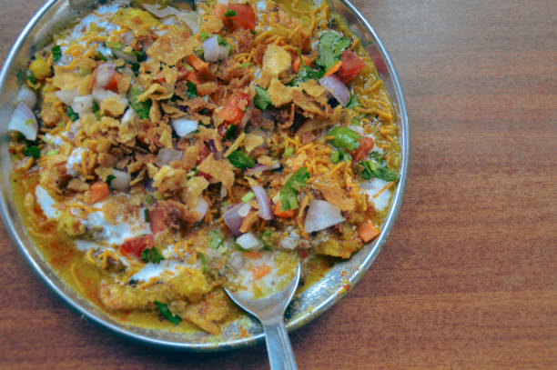 istock Bhel puri chaat served in a plate with a spoon 2182323136