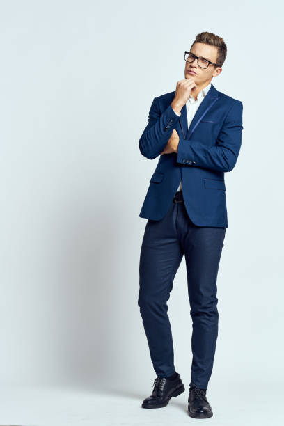 istock business man in suit wearing glasses self-confidence manager executive light background 2182323224
