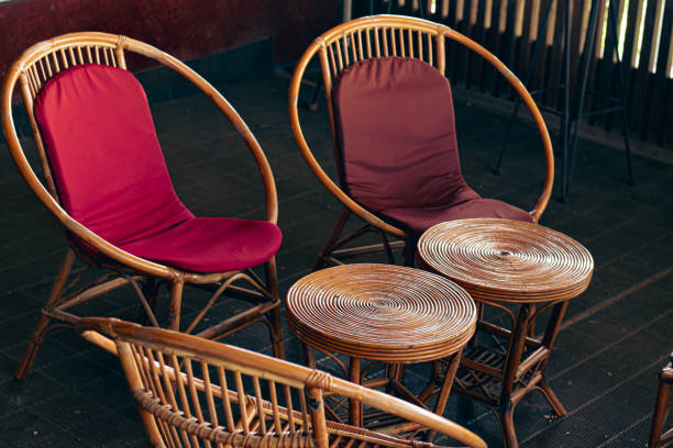 istock Eco-friendly rattan chairs and round tables with red cushions 2182323653