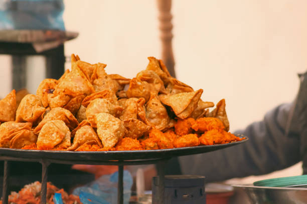 istock A tray filled with golden brown samosas and pakoda 2182323961