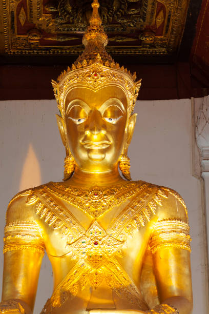 Upper part of golden buddha in Wat Na Phra Men in Ayutthaya near northern area of historical park in city. Buddha has royal ornate and is unique one