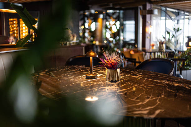 Elegant restaurant interior with decorative centerpiece on a polished marble table, warm lighting, and luxurious ambiance in Istanbul, Turkey